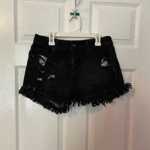 Fringed bottom black denim shorts